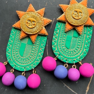 May include: A trio of ceramic mugs with a speckled, matte finish in cream, light grey, and dark grey. Each mug features a simple, minimalist design, ideal for tea or coffee.