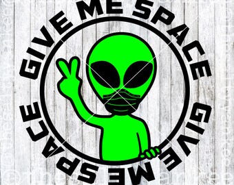 May include: A black and white circle with the text "Give Me Space Give Me Space" around the outside. Inside the circle is a green alien with a black face mask, giving a peace sign.