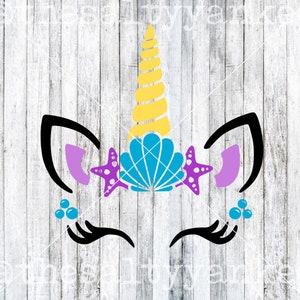 May include: A mermaid unicorn face with a yellow spiral horn, blue seashell, purple starfish, and blue bubbles. The unicorn has black eyelashes and purple ears.