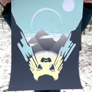 May include: A blue and yellow abstract print featuring a mountain range and two white circles in the sky. The print is on a dark blue background.