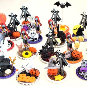 May include: A collection of 15 Halloween themed miniature figurines featuring characters from the Nightmare Before Christmas. The figurines are displayed on small round bases with various Halloween decorations, including pumpkins, ghosts, and tombstones.