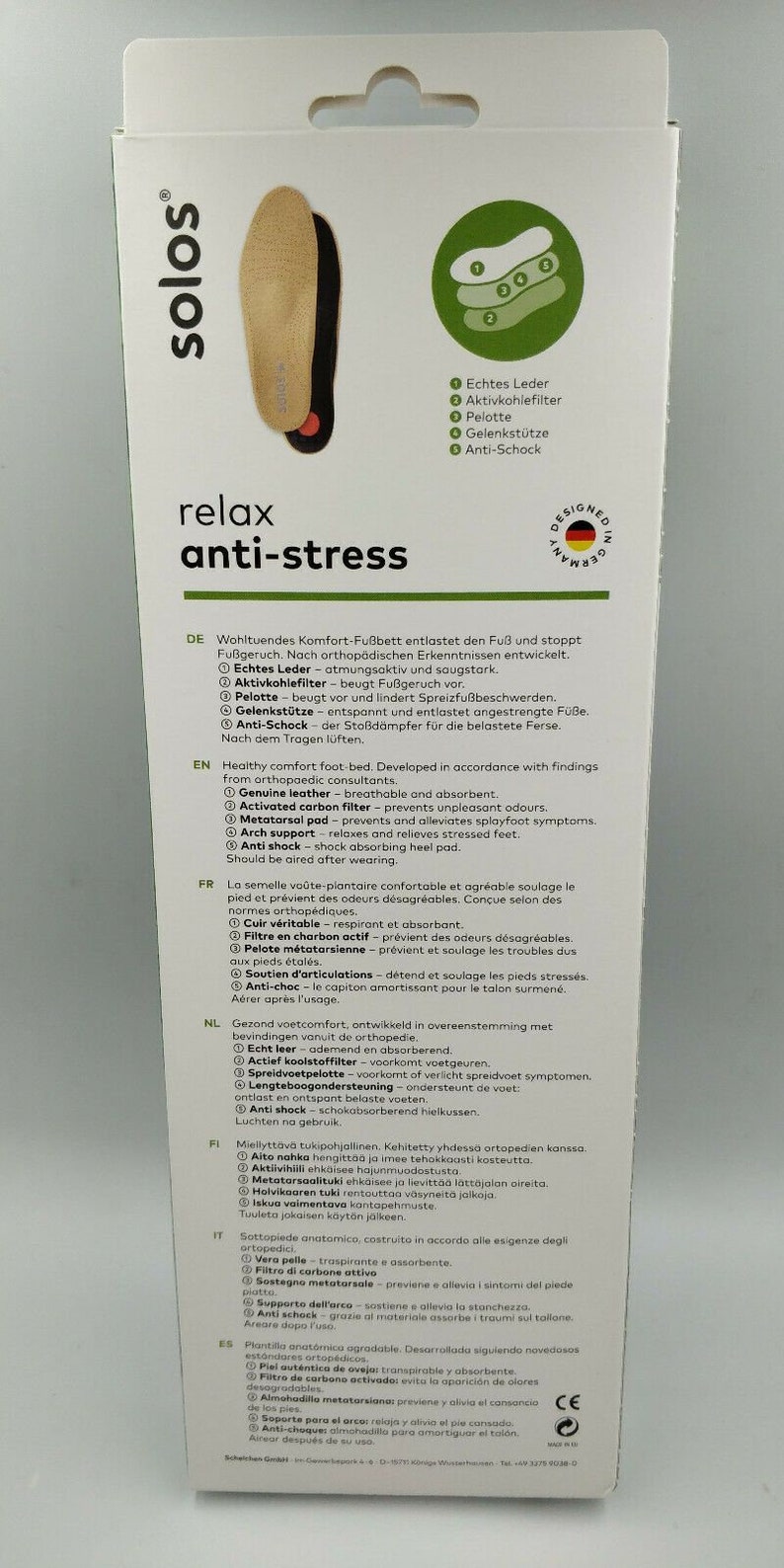 Op de afbeelding: Een witte doos met een paar bruine en zwarte inlegzolen. Op de voorkant van de doos staat "solos relax anti-stress". De inlegzolen zijn gemaakt van echt leer en hebben een actieve koolstoffilter, een spreidvoetkussen, een voetboogondersteuning en een anti-shock hielkussen.