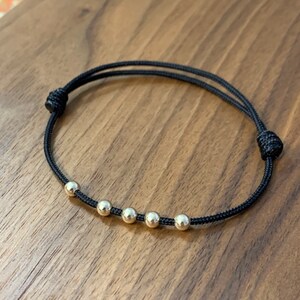 14kt Yellow Gold Filled 5 bead Adjustable Sliding Knot Black and Gold Unisex Stackable Bracelet