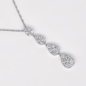 drop diamond cluster pendant, 18k white gold teardrop necklace, 0.53 carat diamond pendant, pear shaped diamond cluster necklace, sparkling teardrop diamond pendant, elegant white gold drop pendant, fine jewelry diamond necklace, dainty diamond drop pendant, statement teardrop necklace, delicate diamond cluster jewelry, timeless drop diamond pendant, luxury diamond teardrop necklace, women’s diamond drop necklace,