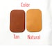 May include: Two leather swatches, one tan and one natural, labeled "Color" above and "Tan" and "Natural" below.