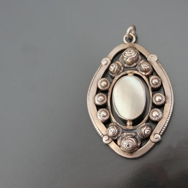 Jugendstil. THEODOR W. HERBSTRITH Floral Mother Of Pearl Pendant. Silver 800. Repousse.