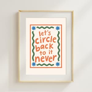May include: A framed wall art print featuring the text "let's circle back to it never" in orange letters. The design includes a rectangular orange border, green wavy lines on the sides, and blue star shapes at each corner on a cream background.