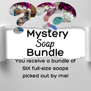 May include: A white background with a torn edge revealing a colourful assortment of handmade soap bars. The text "Mystery Soap Bundle" is written in black text. The text "You receive a bundle of SIX full-size soaps picked out by me!" is written in black text.
