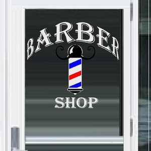 May include: A white barber shop sign with the words "Barber Shop" and a red, white and blue barber's pole.