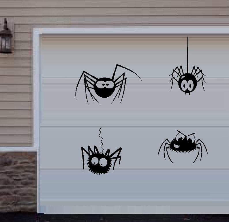 May include: Four black spider silhouettes with googly eyes on a white garage door. The spiders are in various poses, including hanging upside down and crawling.