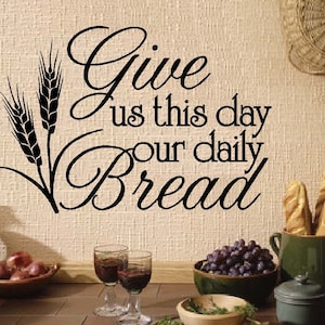 May include: A black and white wall decal with the text "Give us this day our daily bread" and a stylised image of wheat stalks.