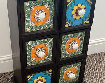 Indian wooden decorative ceramic storage drawers.
