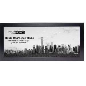 May include: A black rectangular picture frame with a cityscape print. The frame holds 10x24-inch media and includes a stand and wall hanger. The print is not included.