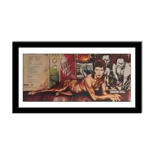 May include: A vintage vinyl record album cover featuring David Bowie. The cover art is a colorful illustration of Bowie as a half-human, half-dog creature. The album title "Diamond Dogs" is printed in white on a black background at the bottom of the cover.