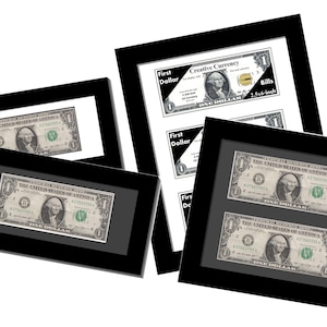 May include: Framed one-dollar bills. The bills feature George Washington and are displayed in black frames. One frame has a single bill, while others have multiple bills. The text "First Dollar" and "Creative Currency" is visible.