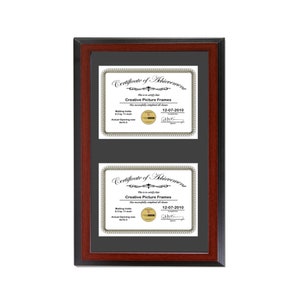 May include: A mahogany wood picture frame with a black mat and two 8.5 by 11 inch openings. The frame holds two certificates of achievement for Creative Picture Frames, dated 12-07-2010.