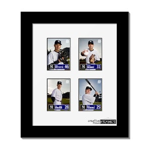 May include: A black framed display featuring four baseball cards of New York Yankees players. Each card has a player's image, name, and number. The frame includes the text "creative FRAMES". The bottom of the frame reads "Note: Baseball cards not included".