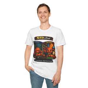 May include: A white t-shirt featuring a graphic print with the text "NPD and Proud". The design shows two orange characters, one labeled "Low Battery" looking tired and one labeled "High Battery" looking energetic, with "Problem Detected - Multi-Thread Activated" text below.
