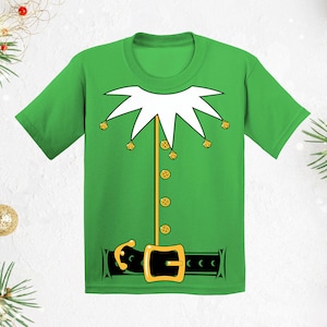 May include: Green t-shirt with a white elf costume design. The design includes a white collar, gold buttons, and a black belt with a gold buckle.