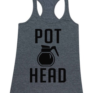 May include: A heather gray tank top with the text "POT HEAD" in black. A black silhouette of a coffee pot is between the words.