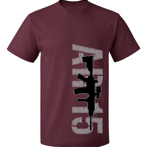 May include: Burgundy t-shirt with a white graphic of a rifle and the word "Guns" printed vertically.