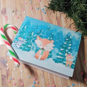 Scène d’hiver aquarelle Woodland fox raton laveur cerf Carte de Noël Drôle mignon animal Carte de Noël aquarelle Chapeau de Père Noël carte de vacances festive