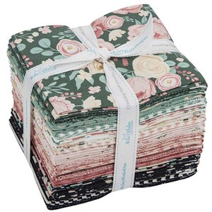 May include: A stack of floral fabric squares in various colors, including green, pink, and black, tied with a white ribbon. The fabric features a variety of floral patterns. The ribbon is printed with the text "Riley Blake Designs" and "Creating high-quality fabrics."