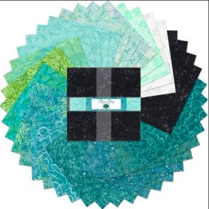 May include: A collection of fabric squares in various shades of teal, green, and black, arranged in a circular pattern. The squares feature patterned designs. A central bundle of black squares is wrapped with a teal band that has text on it.