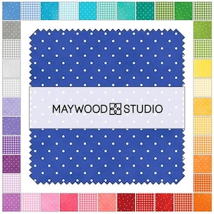 May include: A blue fabric square with white polka dots and a white band featuring the text "MAYWOOD STUDIO." The fabric is surrounded by a variety of small fabric squares in different colors and patterns, suitable for quilting and crafting projects.