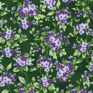 May include: A green fabric with a repeating pattern of purple and light blue flowers. The flowers are clustered together and have a delicate, vintage look.