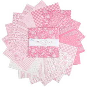 May include: A collection of pink fabric squares arranged in a circular pattern. The fabrics feature various patterns, including floral, gingham, and solid designs. The center displays a package labeled "Sweet Pink."