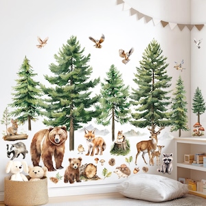 May include: A wall decal set featuring a forest scene with watercolor-style illustrations. The design includes tall green pine trees, various woodland animals like bears, foxes, deer, and owls, and decorative elements such as mushrooms and acorns.