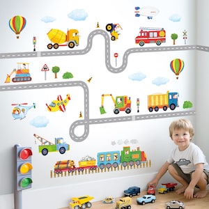 May include: A set of colorful wall decals featuring various vehicles including a cement mixer, fire truck, excavator, helicopter, airplane, and train. The design includes winding gray roads, traffic lights, hot air balloons, and clouds.