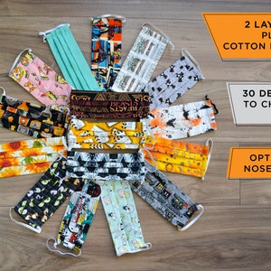 May include: A collection of 14 face masks made from two layers of pleated cotton fabric. The masks feature a variety of colorful and patterned designs. The text on the image reads "2 layers of pleated cotton fabric", "30 designs to choose from", and "Optional nose wire".