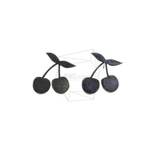 May include: A pair of dark grey cherry earrings. Each earring features two cherries connected by a stem and two leaves. The earrings are set against a white background.