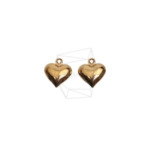 May include: Two gold-colored heart-shaped charms with a loop at the top for attaching to jewelry or other crafts.