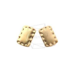 May include: A pair of gold-toned earrings with a rectangular shape and a textured, stitched design.