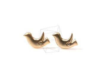 May include: A pair of gold-colored dove earrings. Each earring features a stylized dove design with a small round accent.