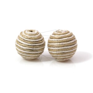 May include: Two round, beige and white striped decorative balls made of woven twine.