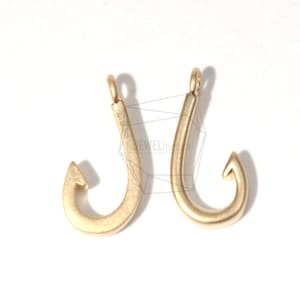 May include: Two gold-colored metal hooks, each with a loop at the top for attaching to a chain or cord. The hooks are about 2 inches long and have a smooth, polished finish.