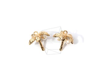 May include: Two gold palm tree charms with a white pearl accent. The charms are perfect for adding a tropical touch to jewelry making projects.