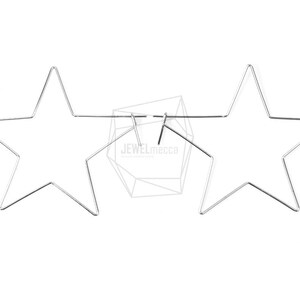 May include: A pair of silver star-shaped hoop earrings. The earrings are made of thin metal wire and are connected by a small hoop at the top.