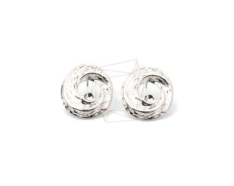 May include: A pair of silver earrings with a textured, circular design. Each earring has a small, round bead in the center.