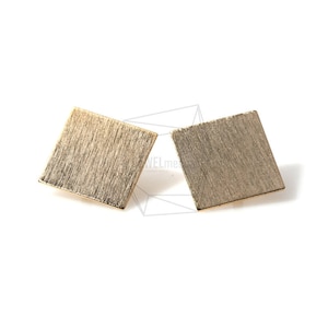 May include: A pair of gold square earrings with a brushed finish.