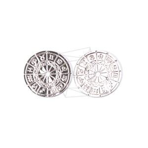 May include: Two silver-colored metal zodiac wheel charms with the astrological signs and symbols around the edge.