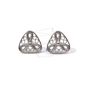 May include: A pair of silver triangle earrings with a delicate filigree design featuring a flower motif.