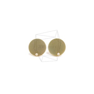May include: Two gold-colored metal circles with a small hole in the center. The circles are smooth and have a slightly textured surface.
