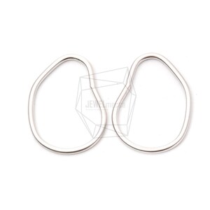 May include: A pair of silver, organic shaped hoop earrings. The earrings are smooth and have a slightly irregular oval shape.