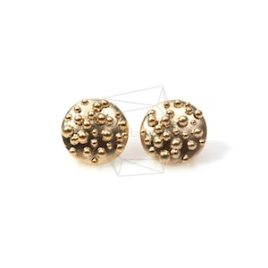 May include: A pair of gold-toned stud earrings with a textured, bubble-like surface.