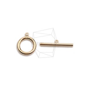 May include: Gold-toned metal toggle clasp with a round ring and a straight bar. The clasp is used for jewellery making.
